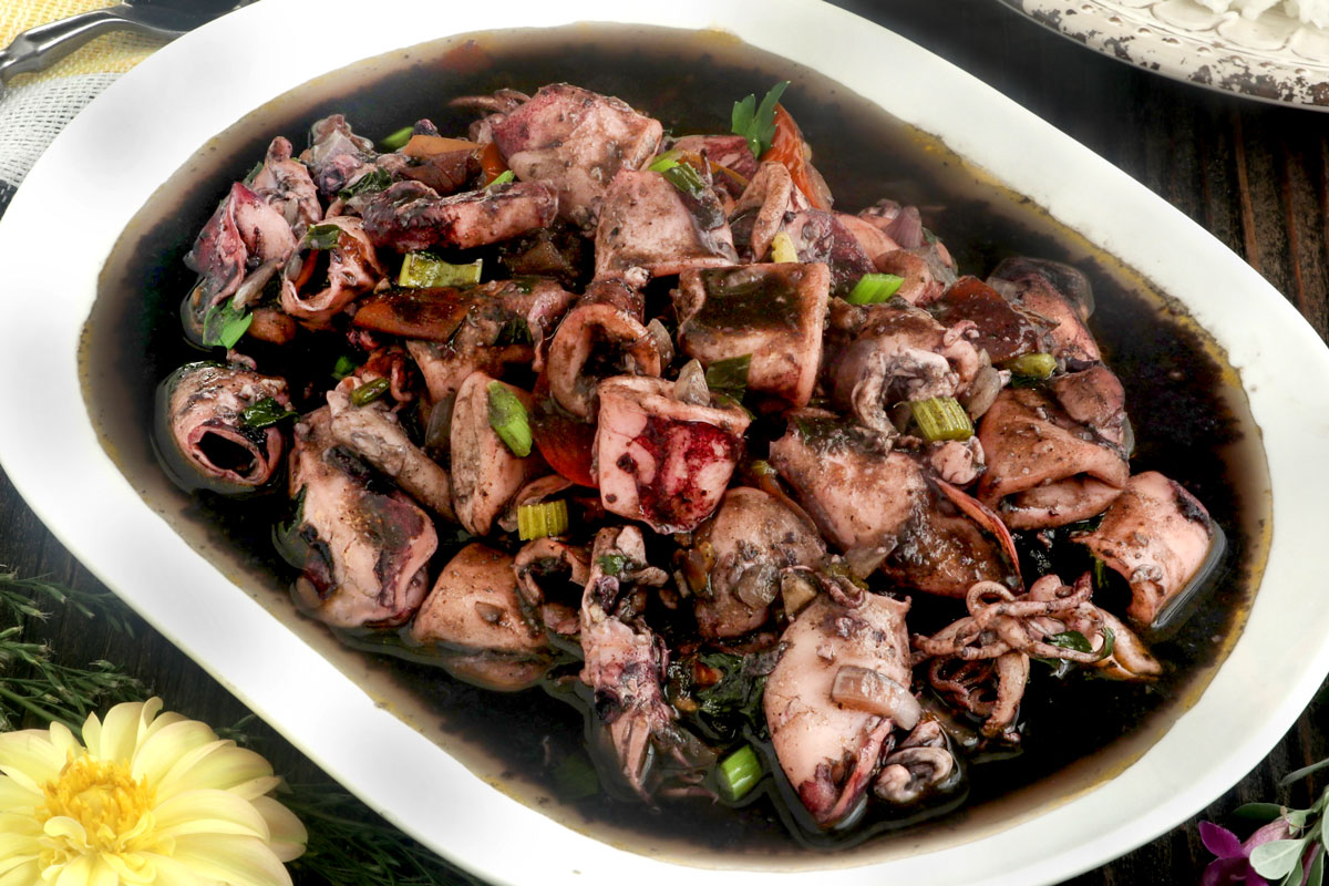 Filipino squid adobo in a serving platter.