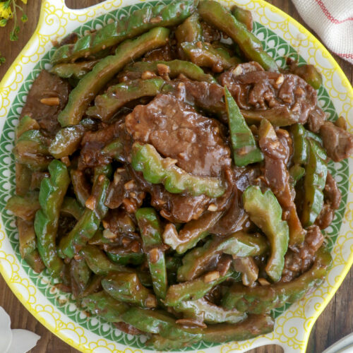 Ampalaya Con carne is a dish of bitter melon with tender beef slices stir-fried in a mixture of soy and oyster sauce.