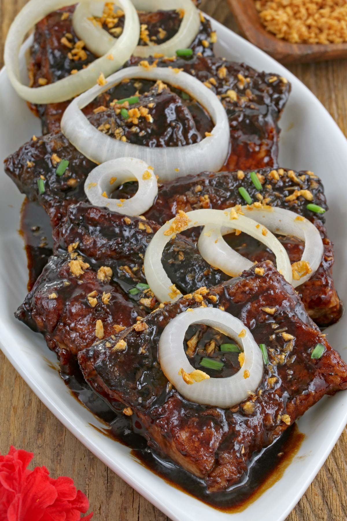 Fried boneless bangus/milkfish belly with tangy soy-sauce glaze sprinkled with toasted garlic.