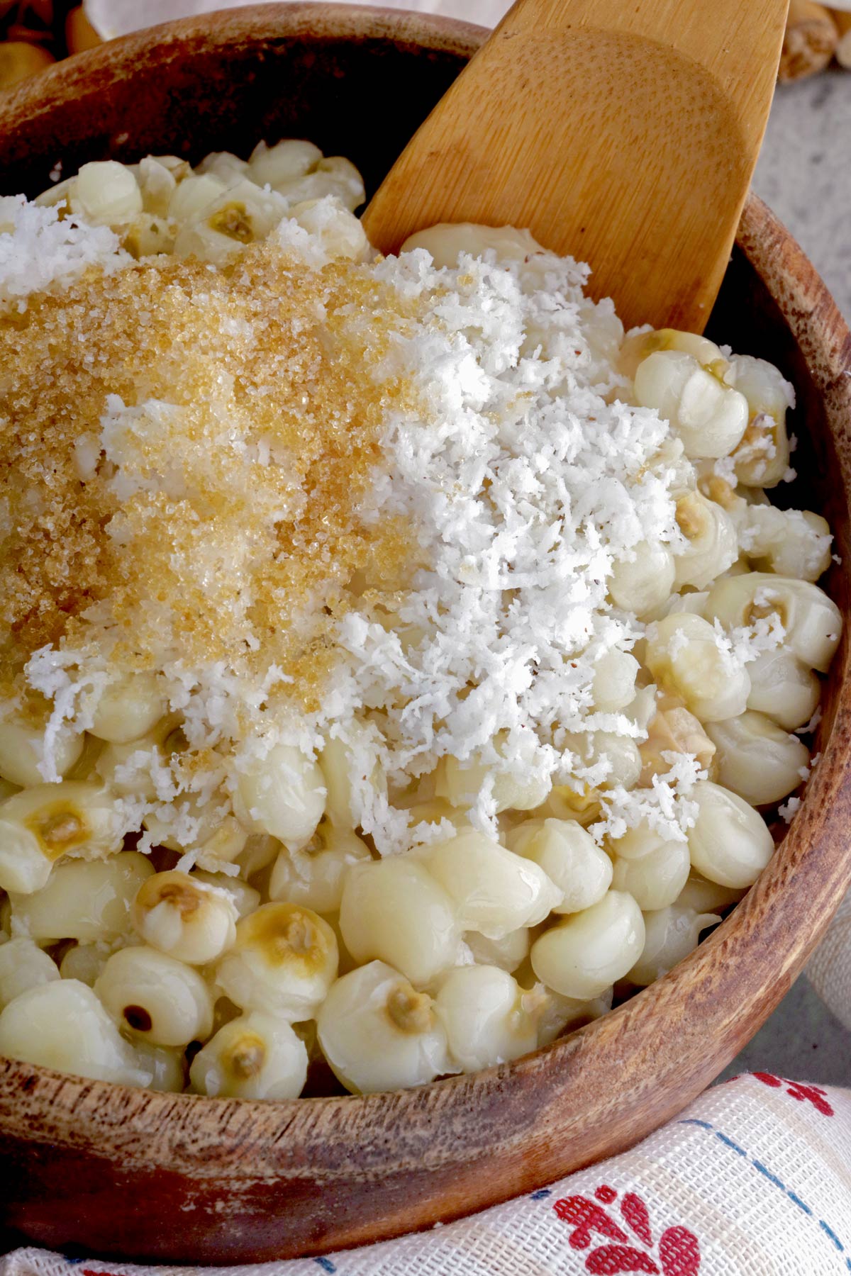 Filipino hominy topped with grated mature coconut and sugar.