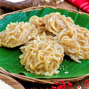 Bukayo on a banana leaf lined serving platter.