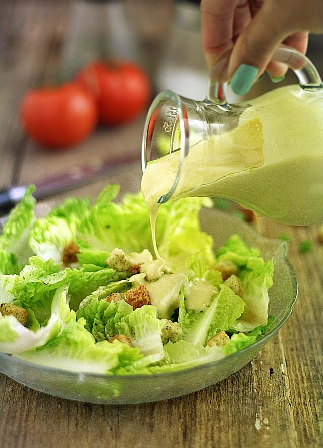 Try this simply and very easy homemade Caesar salad dressing. No raw egg needed. | www.foxyfolksy.com