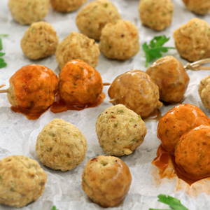 Chicken balls fried until golden served with two different dips.