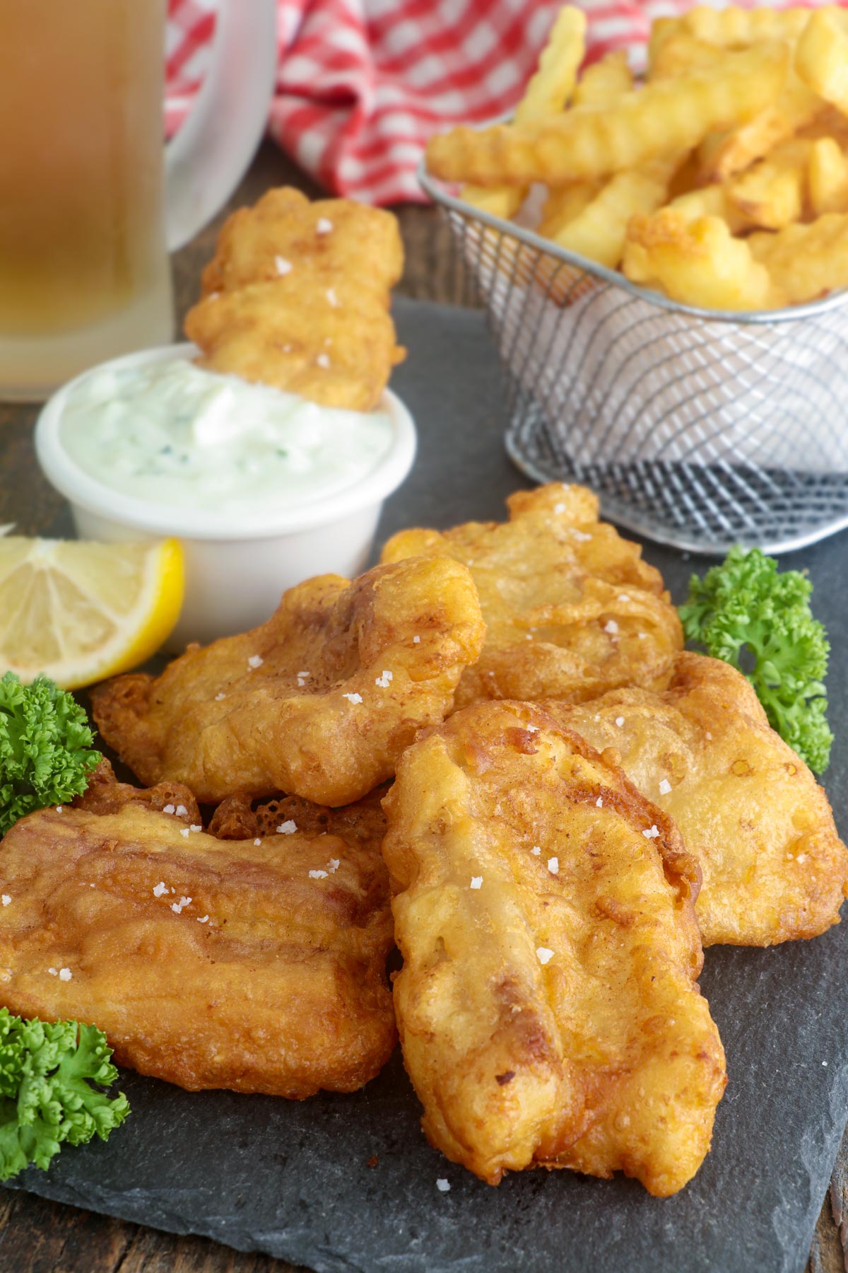 Beer battered fish with crisp and light coating and tender fish inside.