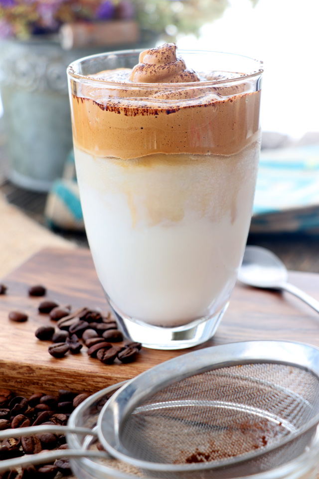 whipped coffe on top of iced milk