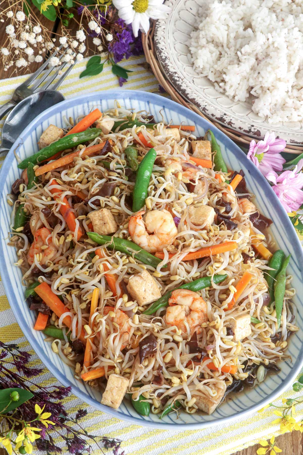 Ginisang togue on a serving platter served with steamed rice.