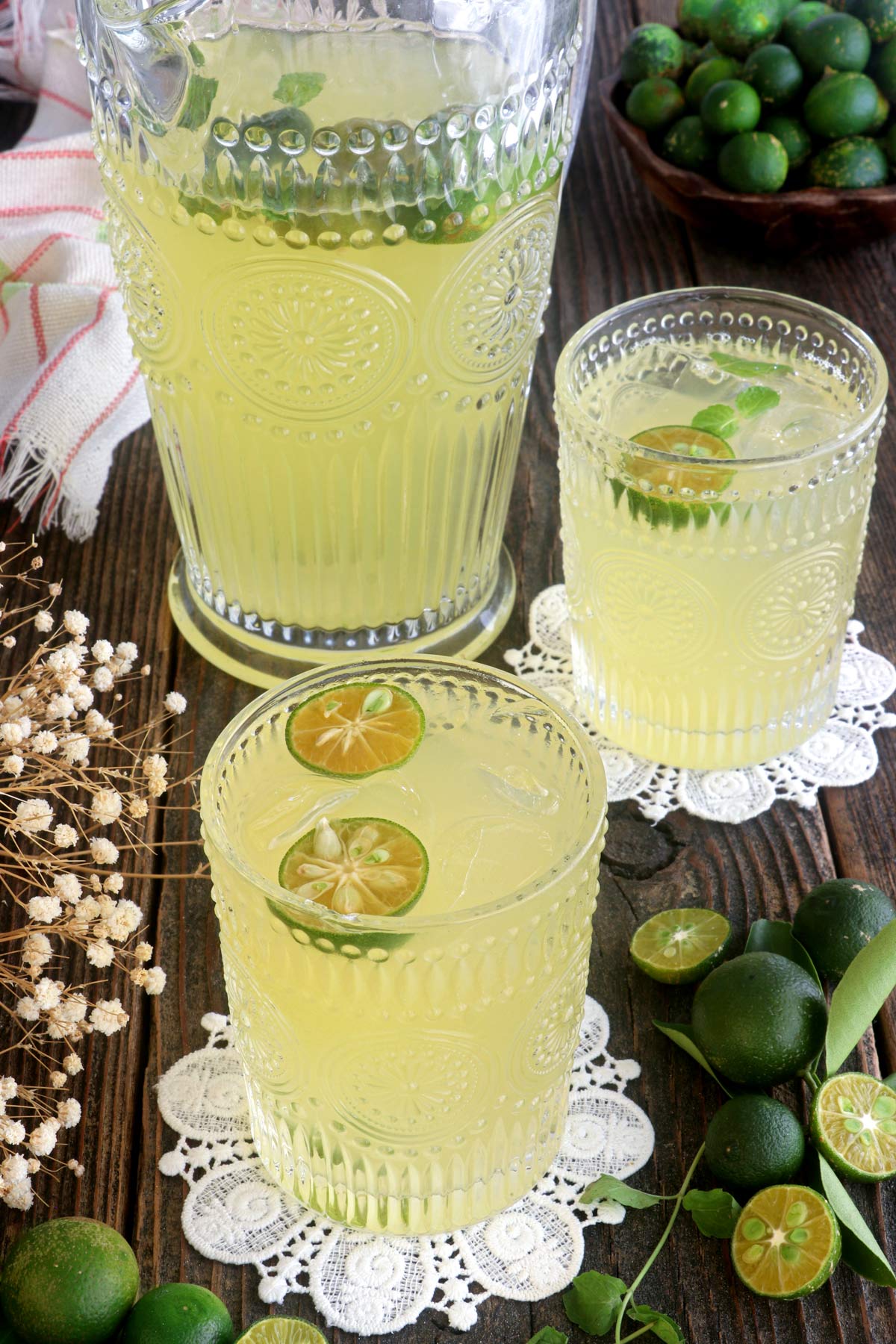 Calamansi juice in a pitcher and served in glasses over ice.