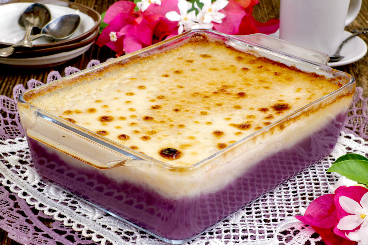 Inutak in a baking dish with an ube and coconut flavored layers.