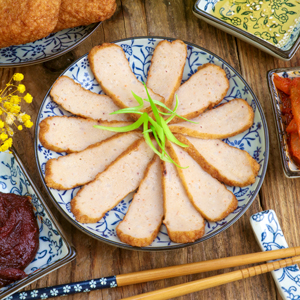 Freshly cooked Homemade Korean Fish Cake on a serving plate served with dipping sauce.