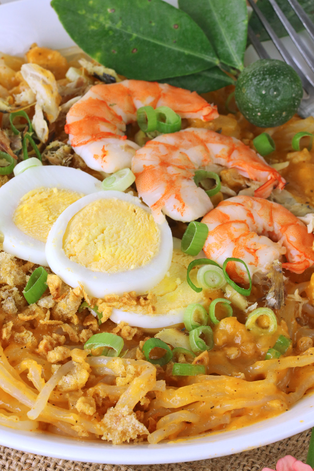 rice noodle with orange savory sauce, eggs, and shrimp 