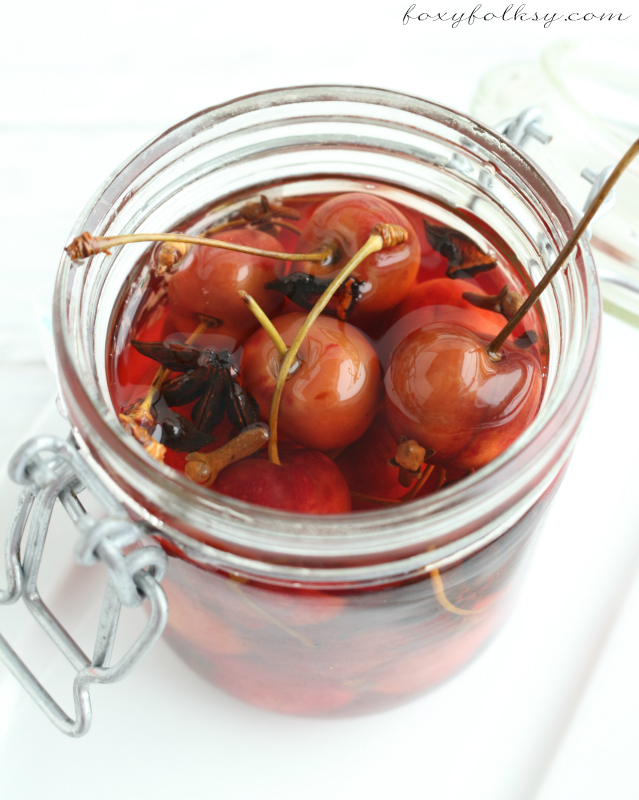 These pickled cherries are just simply and surprisingly amazing-sweet, tangy and perfectly spiced! The process and ingredients involved is really so simple. | www.foxyfolksy.com