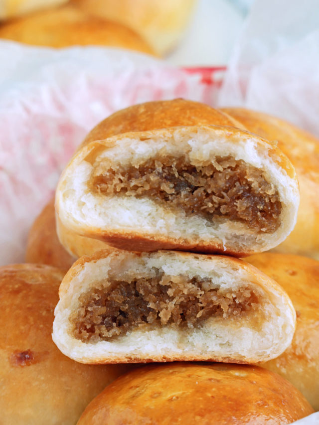 Pan de Coco are Filipino sweet buns stuffed with sweet grated coconut.