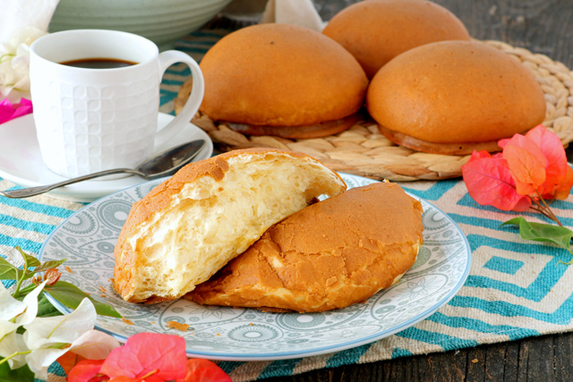 Soft and fluffy coffee buns cut into halves. 