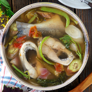 Sinigang na bangus in a serving bowl.