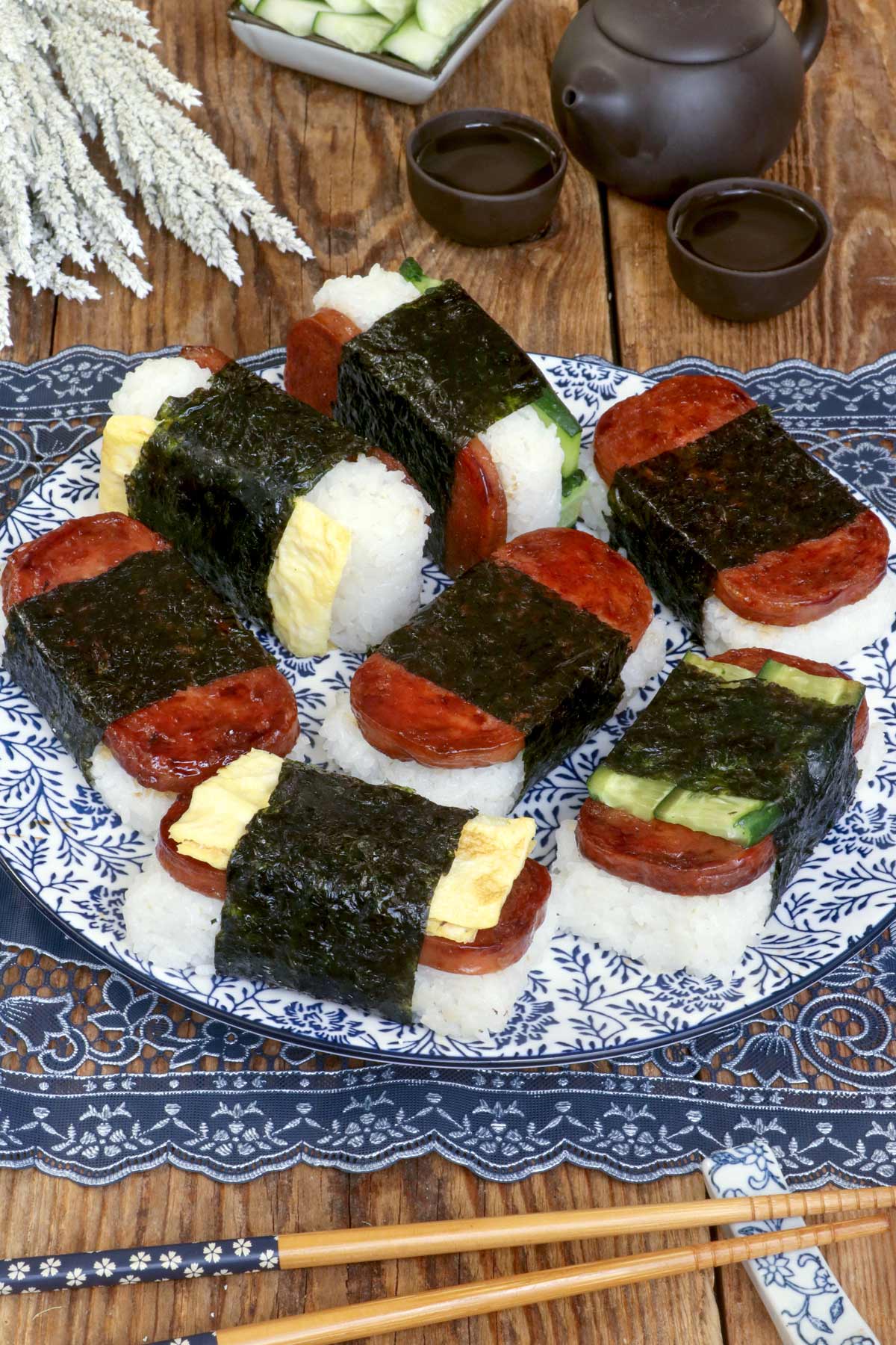 Different varieties of Spam Musubi on a serving plate.