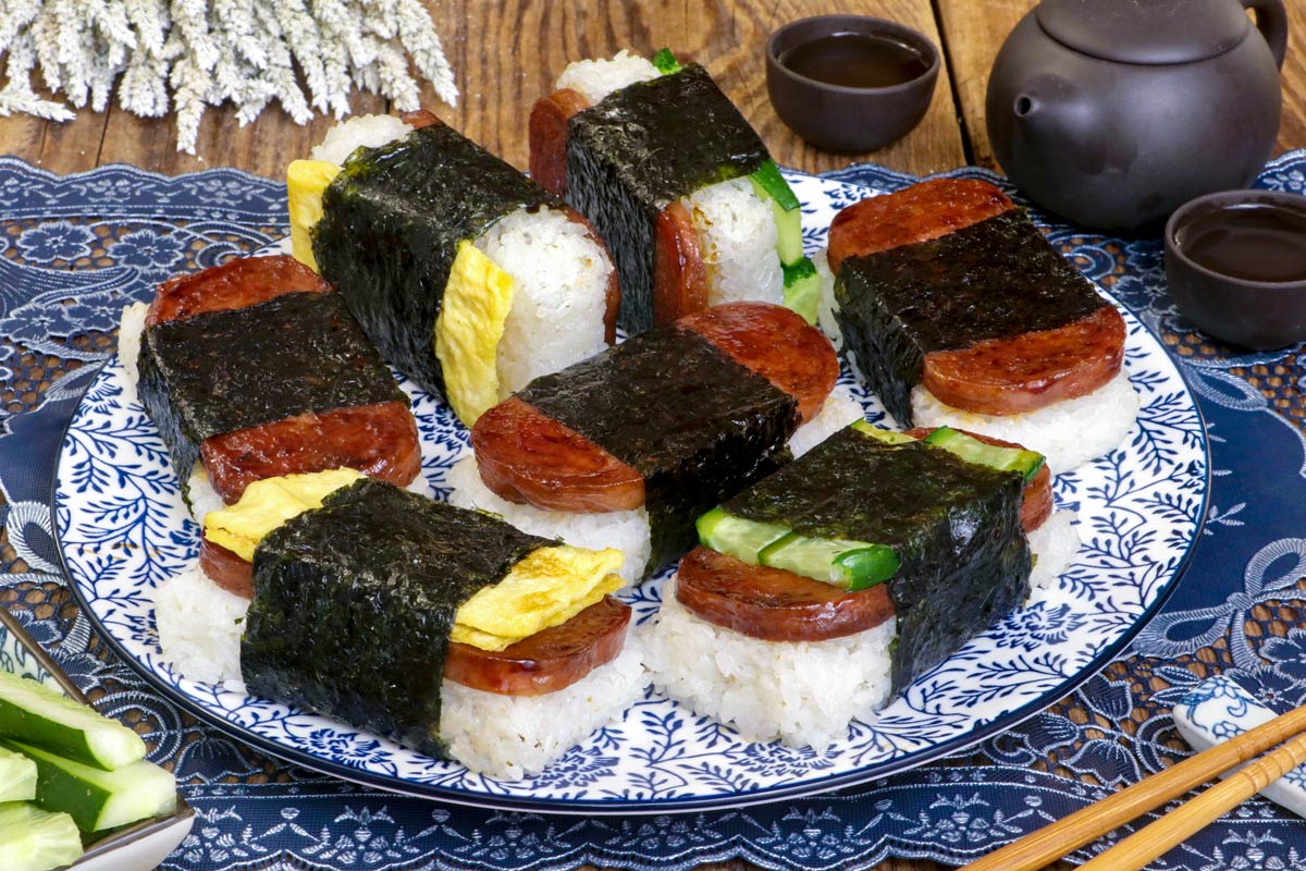 Different varieties of Spam Musubi on a serving plate.