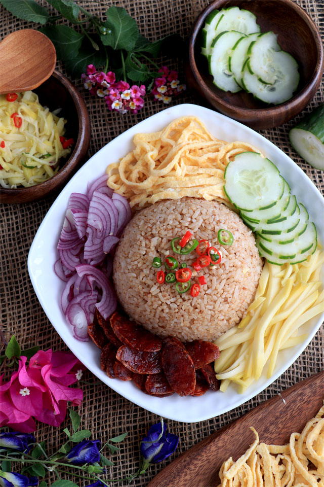 Thai Rice with shrimp paste and sides: green mango, red onions, egg, cucumber and Chinese sausage