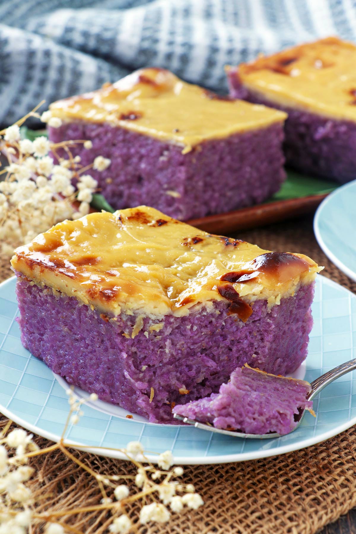 Filipino rice cake with purple yam and custard topping.