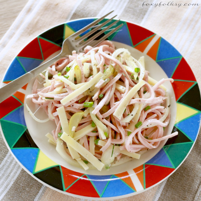 Wurstsalat or literally Sausage Salad is basically a type of sausage cut into julienne (long, thin) strips and then seasoned with vinegar, oil and pickles. | www.foxyfolksy.com