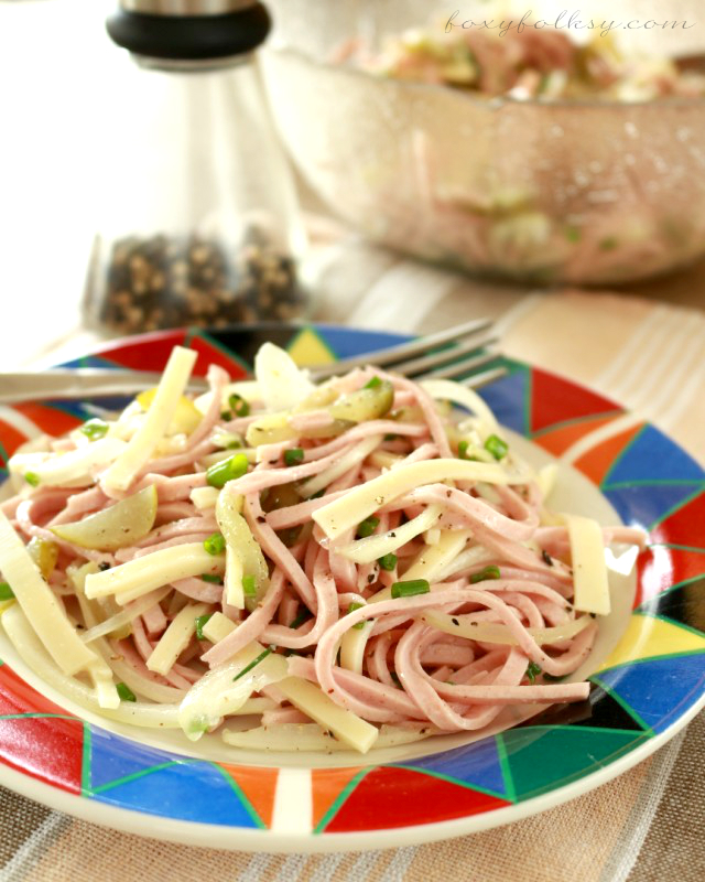 Wurstsalat or literally Sausage Salad is basically a type of sausage cut into julienne (long, thin) strips and then seasoned with vinegar, oil and pickles. | www.foxyfolksy.com